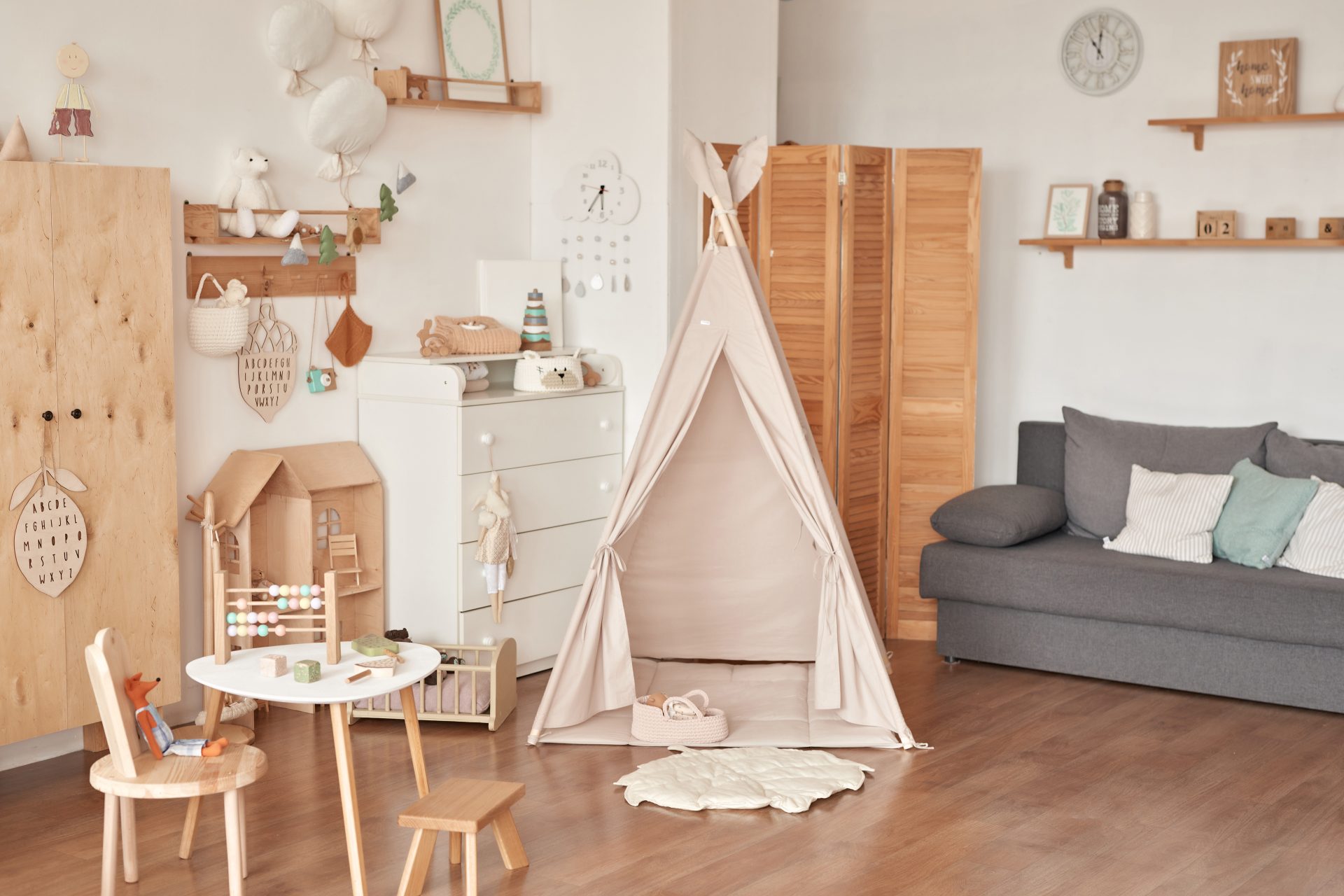 Children’s educational wooden toys. Nursery decor. Scandinavian style playroom. Wigwam